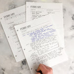 Load image into Gallery viewer, A hand fills in the February daily notes page

